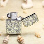 Open KZ133 silver-and-gold Zippo Armor lighter showing the reverse scrollwork