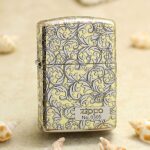 Silver-and-gold arabesque Zippo Armor lighter with numbered No. 0305 front plaque