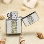Open Jeep chrome Zippo Armor lighter showing the tire-track reverse design
