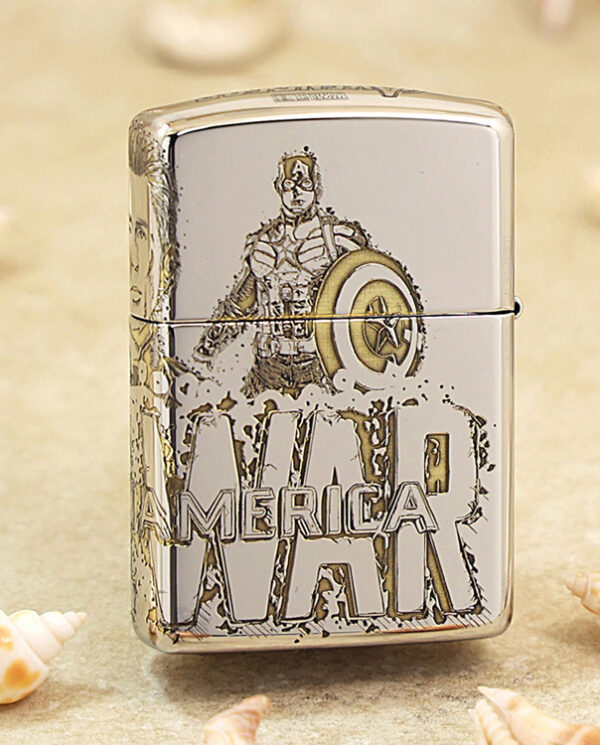 KZ142-01 Metal lighter featuring Captain America illustration and shield, with bold 'AMERICA' lettering on a sandy surface with seashells nearby