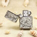 Open Chinese phoenix Zippo Armor lighter showing front bird and floral engraving