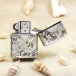 Open KZ143 chrome Zippo Armor lighter showing the reverse phoenix artwork