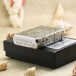 Zippo base stamp and engraved scrollwork edges of KZ143 chrome Armor lighter