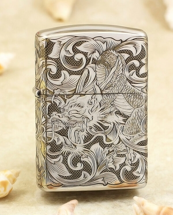 KZ143 Silver lighter with an intricate black-and-white dragon and scrollwork engraving on its surface