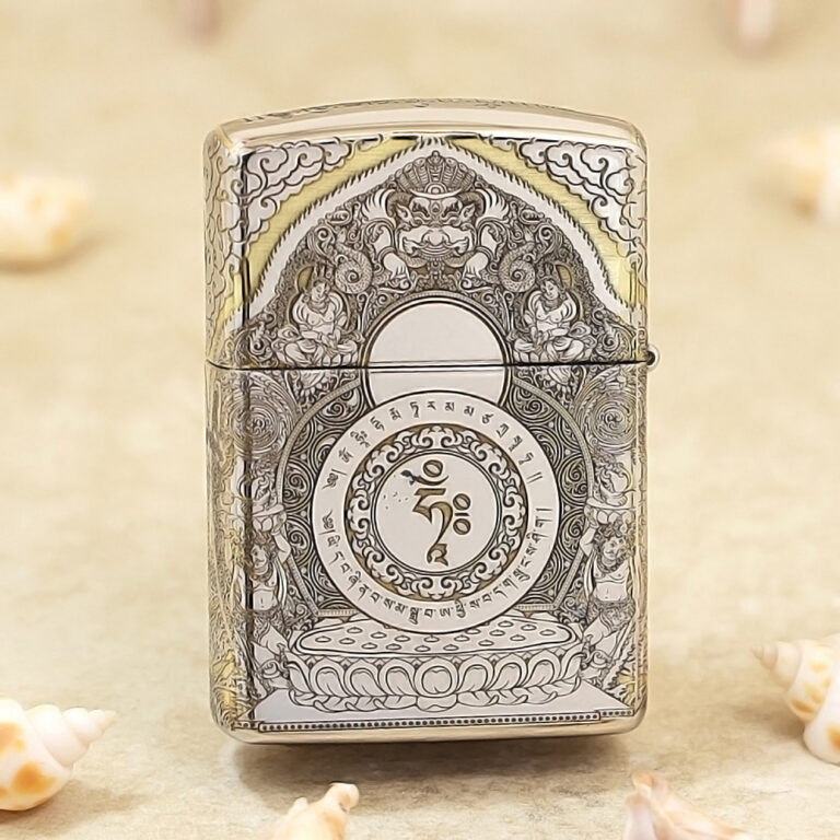 Metallic lighter with an intricate mandala engraving and a central Om symbol.