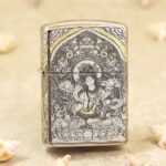 White Tara seated on a lotus engraved on antique silver-tone Zippo Armor lighter