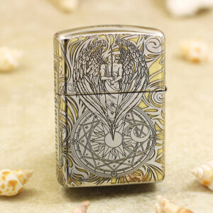 Zippo lighter with an engraved angel and wings over a circular geometric design on the front lightened by a silver surface.