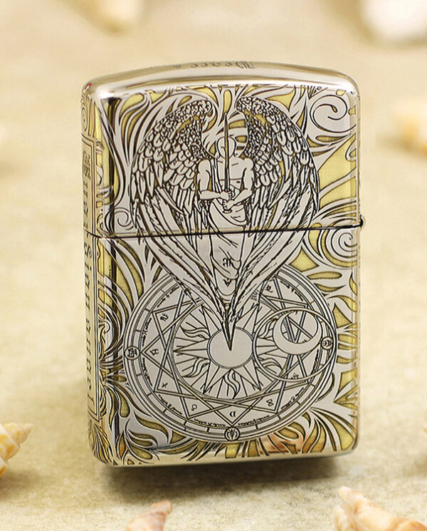 KZ145-01 Zippo lighter with an engraved angel and wings over a circular geometric design on the front lightened by a silver surface.