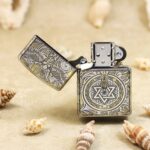 Open guardian angel Zippo Armor lighter showing front medallion and lid engraving