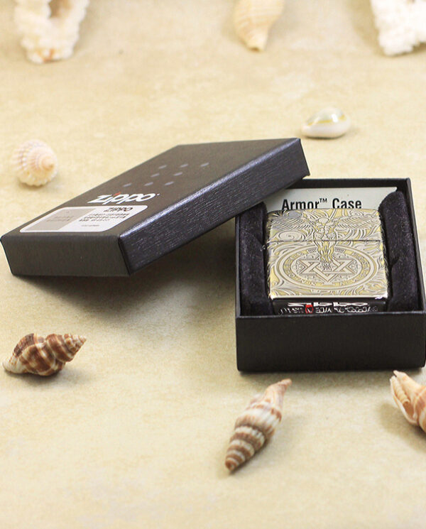 KZ145-06 Open black box revealing an ornate, gold-patterned card labeled 'Armor Case' on a sandy surface with seashells nearby, inner velvet lining visible