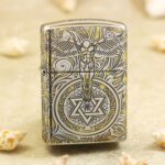 Winged guardian angel and geometric medallion engraved on chrome Zippo Armor lighter
