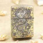 Reverse of KZ146 Zippo Armor lighter with coiling dragon and dense cloud scrollwork