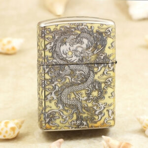 KZ146-01 Metal lighter with an intricate dragon engraving in dark lines on a gold-tone surface.