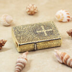 Five-sided engraved brass Zippo Armor showing cross motif and hinge side