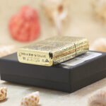 D 22 Zippo Armor bottom stamp and Latin-inscribed side of brass lighter