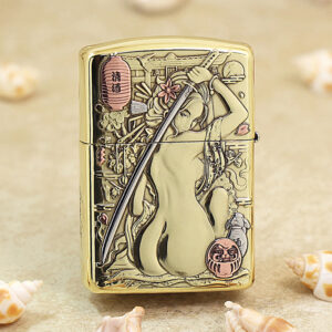 Gold Zippo lighter with an Asian-inspired engraving of a woman holding a sword, surrounded by flowers and a pink lantern.
