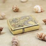 Dragon geisha engraved brass Zippo Armor lighter lying flat