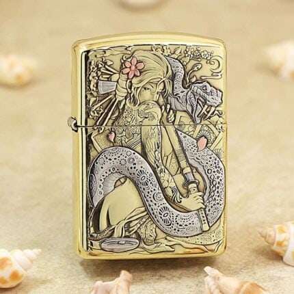 Polished brass Zippo Armor lighter with a geisha and coiling dragon engraved on the front