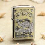 Vintage Wides tobacco-pack artwork with camel and desert palms on chrome Zippo Armor lighter