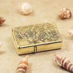 Long-haired cat engraved brass Zippo Armor lighter lying flat