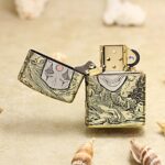 Open clown mask Zippo Armor lighter showing engraved face and wave details