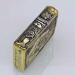 Five-side KZ157 Zippo Armor lighter showing Western bottle and Liberty side motifs