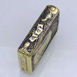 KZ157 Zippo Armor lighter side engraving with playing cards, revolver, and scrollwork