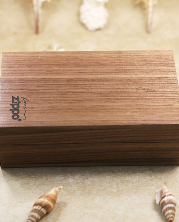 KZ158-07 Wooden rectangular jewelry box with a dark walnut finish on a beige surface, logo on the lid visible in the corner.