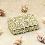 Full-wrap arabesque engraved brass Zippo Armor lighter lying flat