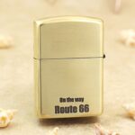Brushed brass reverse of KZ160 lighter with On the Way Route 66 lettering