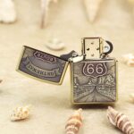 Open Route 66 Zippo Armor lighter showing highway, mountains, and shield artwork