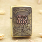Brass lighter with a Route 66 desert scene and 'On the Way' banner engraved on the front panel