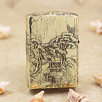 Gold engraved lighter with a detailed landscape scene of trees, a pavilion, and a boat on a river in relief artwork.