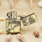 Open KZ172 Zippo Armor lighter showing the reverse lady figure and floral engraving