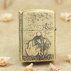 KZ174-01 Gold lighter with a skeleton couple embracing on a sandy beach under a crescent moon.