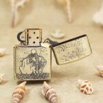 Open KZ174 Zippo Armor lighter showing the moonlit skeleton lovers reverse scene