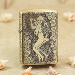 Skeleton woman reclining among roses engraved on KZ174 brass Zippo Armor lighter