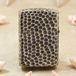Full-wrap snakeskin scale texture on the reverse of KZ175 Zippo Armor lighter