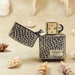 Open limited-edition snakeskin Zippo Armor lighter showing the numbered front badge