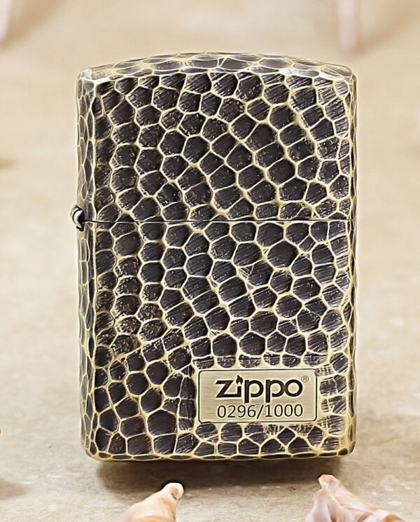 KZ175 Zippo lighter with a black and beige snakeskin texture standing upright on a neutral surface.