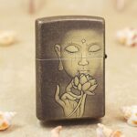 Reverse of KZ179 antique brass Zippo lighter with Buddha face holding a lotus blossom