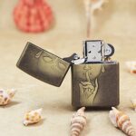 Open Buddha Zippo lighter showing the silence gesture artwork on front and lid