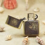 Open Zippo Armor lighter showing the engraved tiger and cub front panel