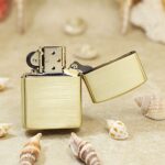 Open KZ184 Zippo Armor lighter showing its plain brushed brass reverse