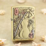 Stylized nude katana woman in Japanese art engraved on polished brass Zippo Armor lighter