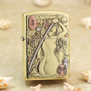 Gold Zippo-style lighter with engraved artwork of a woman holding a sword, surrounded by flowers and lanterns. Note: concise informative description, focuses on the image's meaning as a decorative lighter.