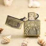 Open samurai brass Zippo Armor lighter showing front warrior and lid engraving