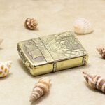 Multi-side samurai engraving on brass Zippo Armor lighter lying flat