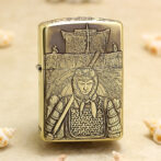Brass Zippo lighter with an etched samurai in full armor and a sword across his chest.