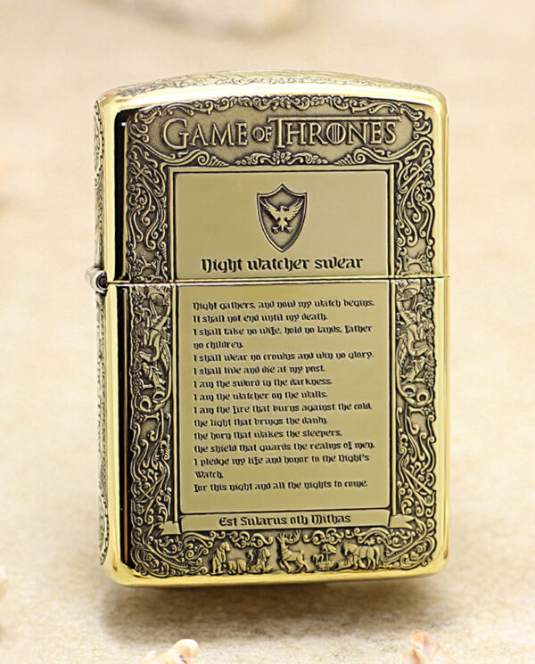 KZ196 Gold-toned lighter engraved with Game of Thrones motifs and 'Night watcher swear' text on a parchment panel